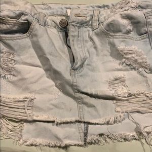 Light wash ripped denim skirt